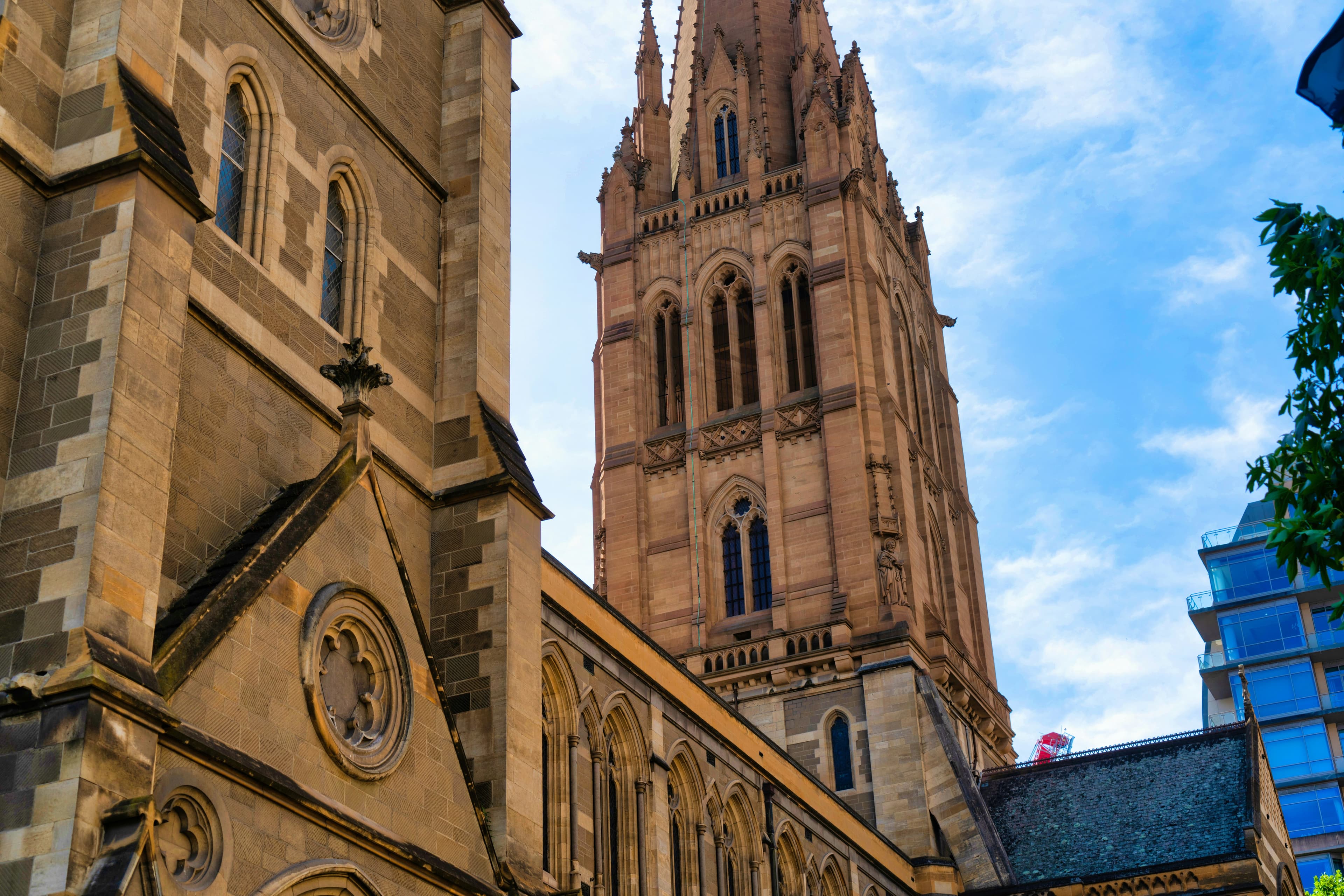 St Paul's Cathedral, Melbourne — sandstone tower against sky